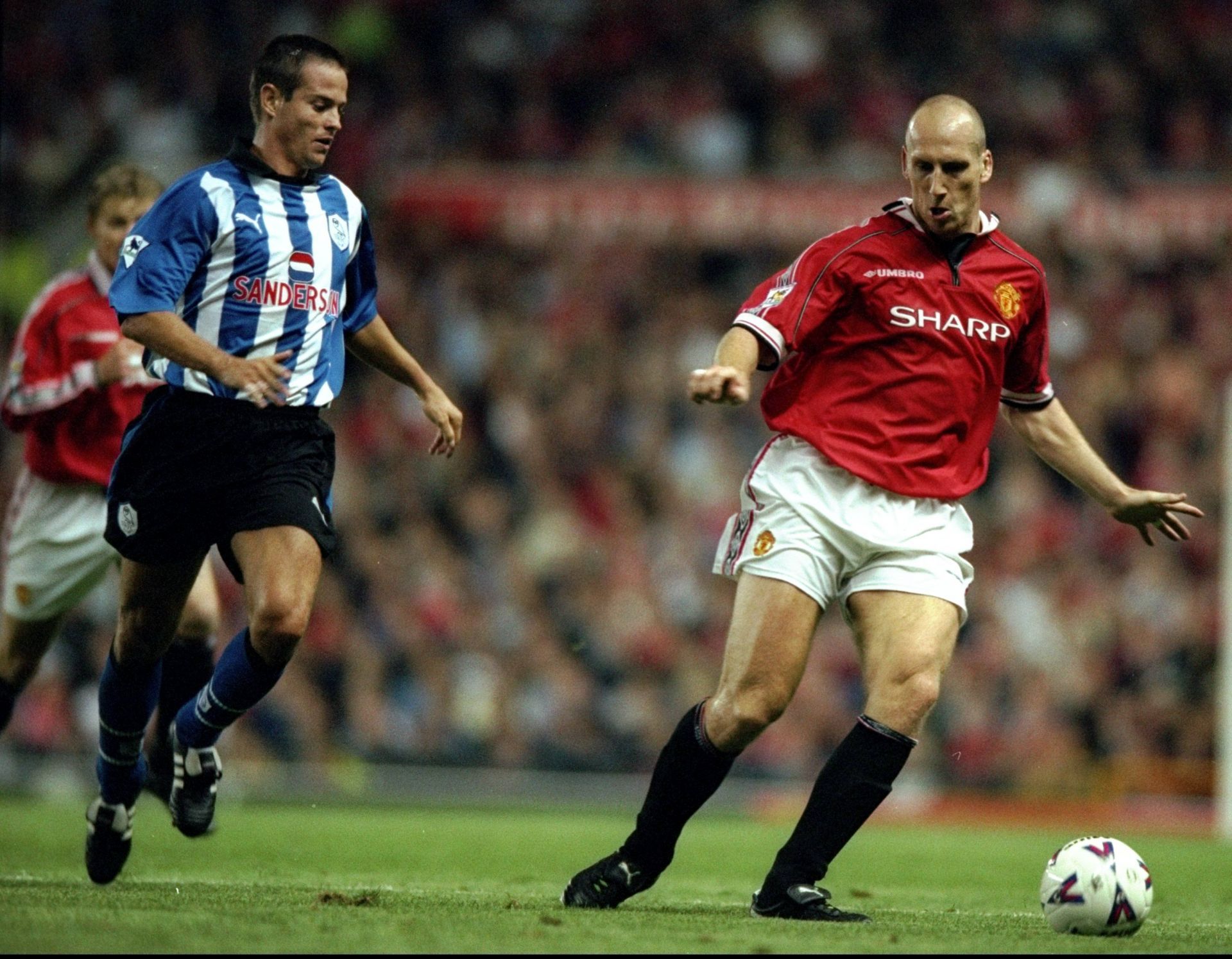 Jaap Stam (right) was rock-solid at the back for the Red Devils
