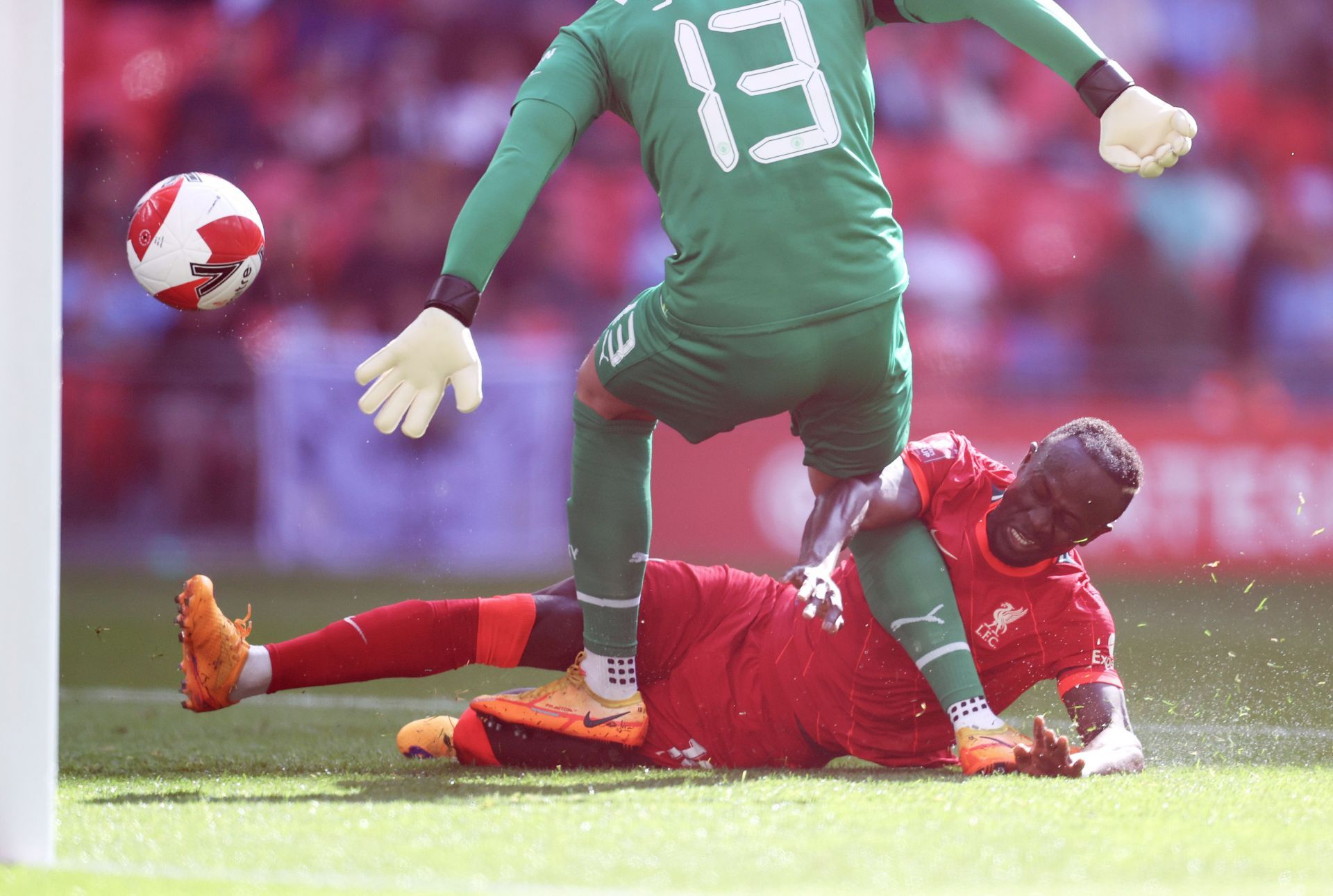 Sadio Mane (C) slides in to score Liverpool's second goal past Zack Steffen (#13)