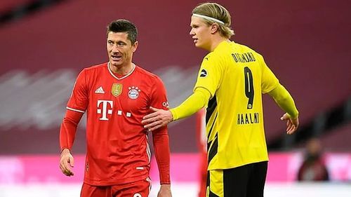 Erling Haaland and Robert Lewandowski engage in conversation during one of their games.