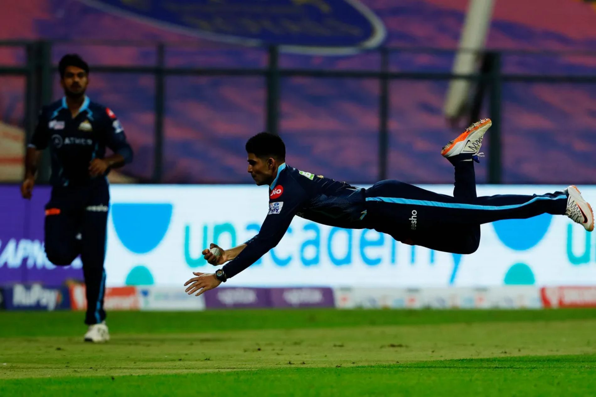 GT opener Shubman Gill takes a sensational flying catch to send back LSG batter Evin Lewis in Match 4. The mistimed ball went high in the air, but Gill kept his eyes on it till the last moment and pulled off a stunner.