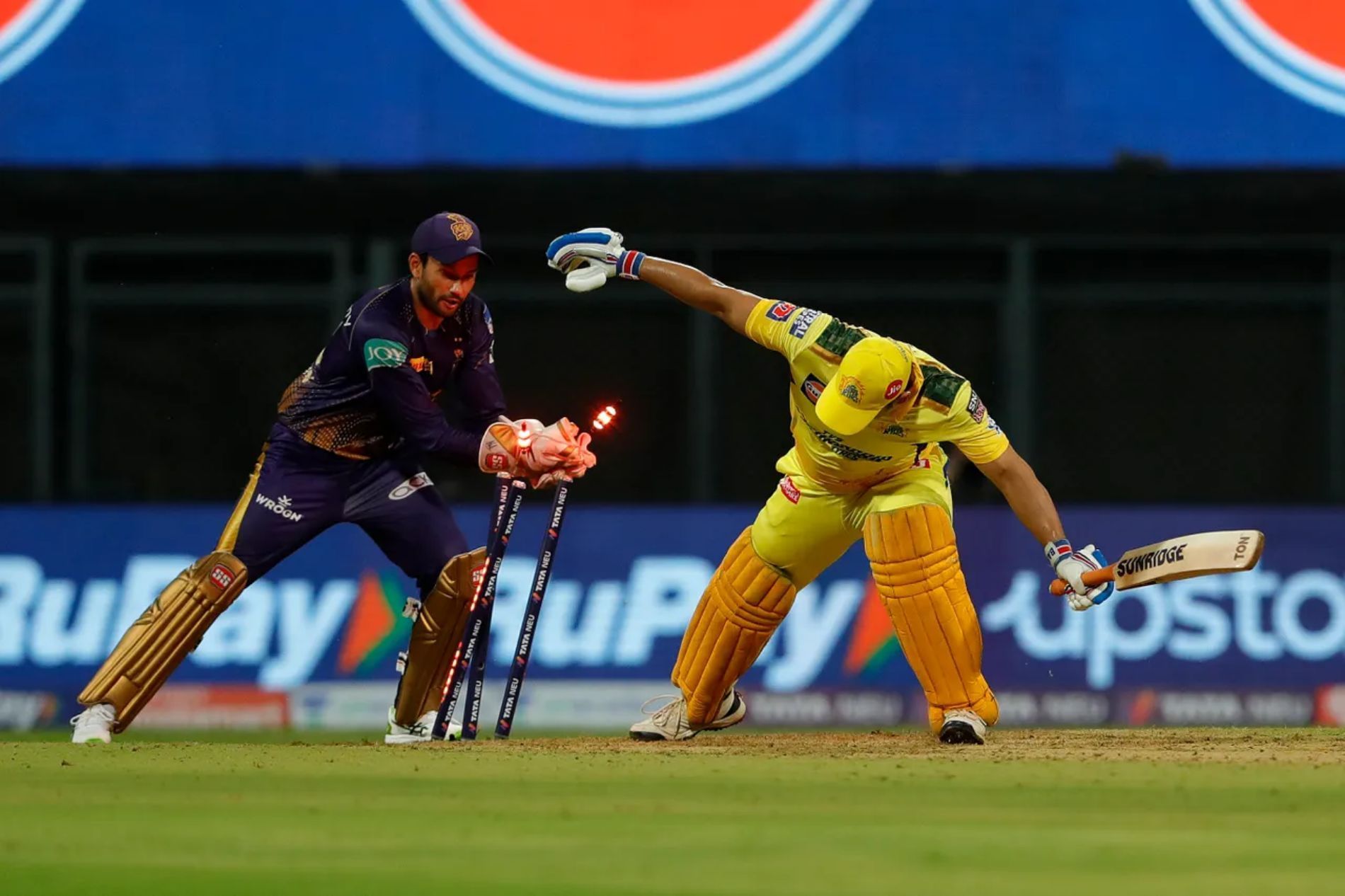 KKR’s Sheldon Jackson tries to stump CSK’s MS Dhoni during the opening match of IPL 2022. Although Dhoni remained unbeaten on 50, Chennai ultimately lost the game.