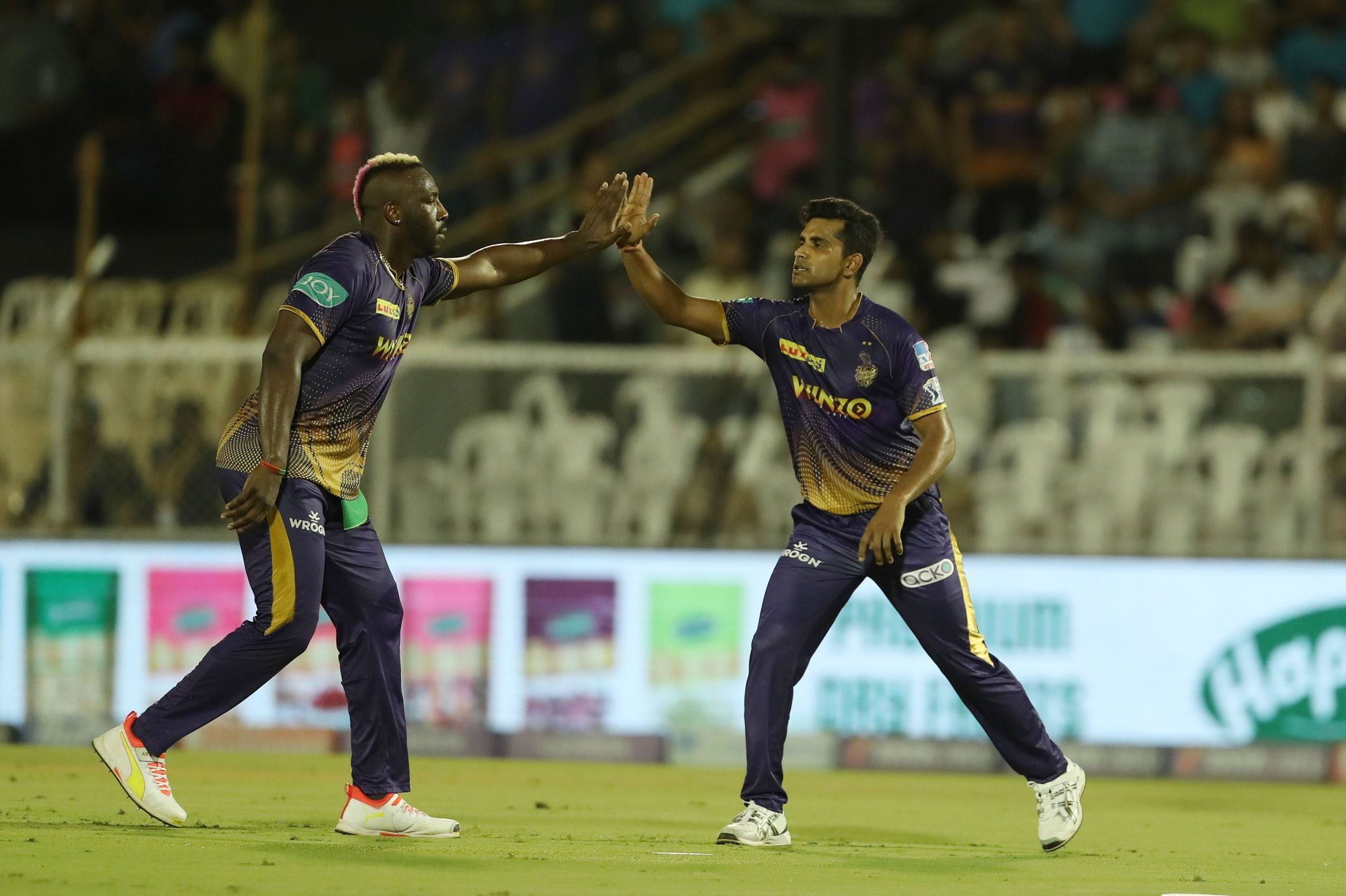 Shivam Mavi (R) celebrates with Andre Russell after the back of Sanju Samson [Credits: IPL]