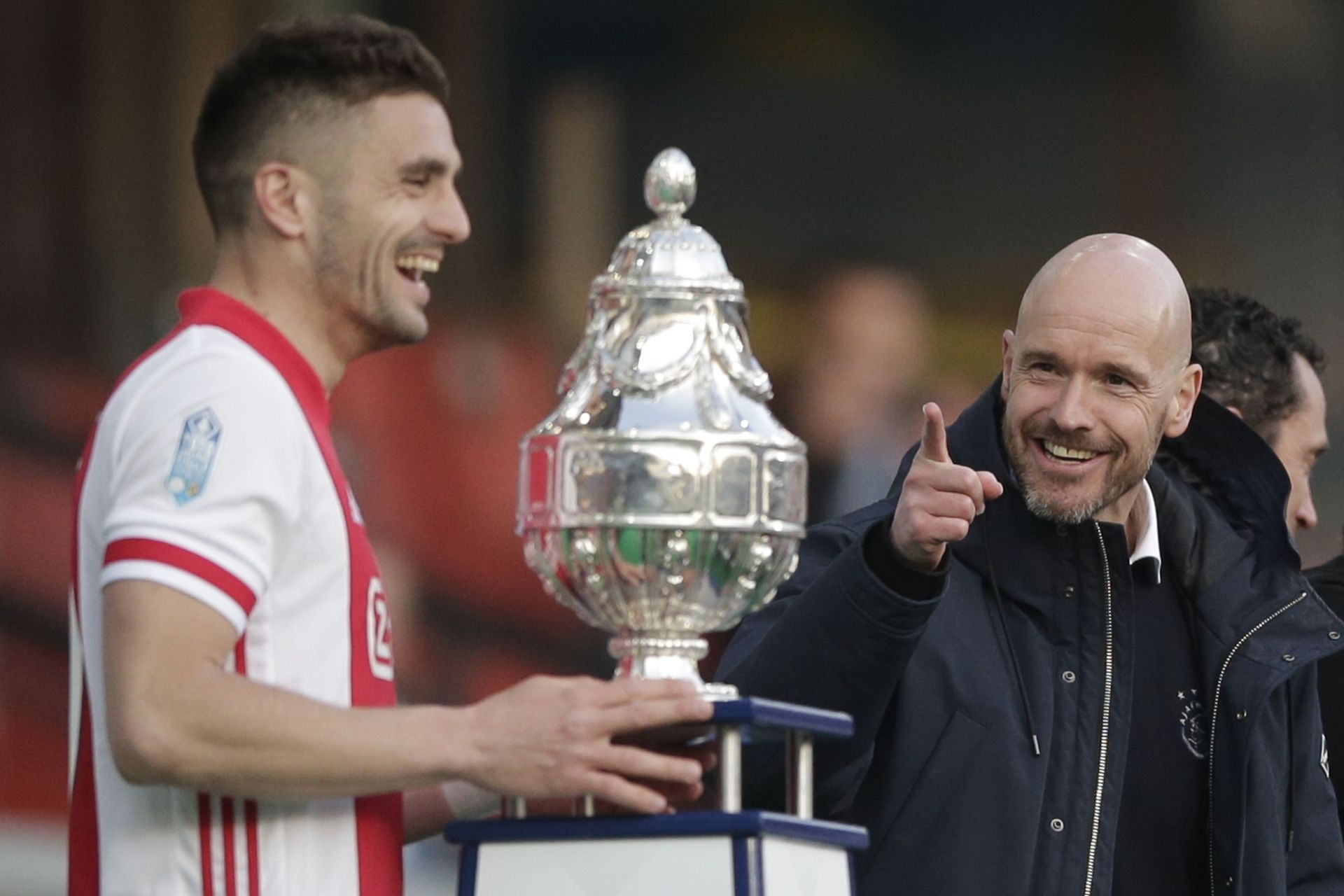 Ajax's Dusan Tadic (right) celebrates the team's KNVB Cup win as Ten Hag (right) looks on.