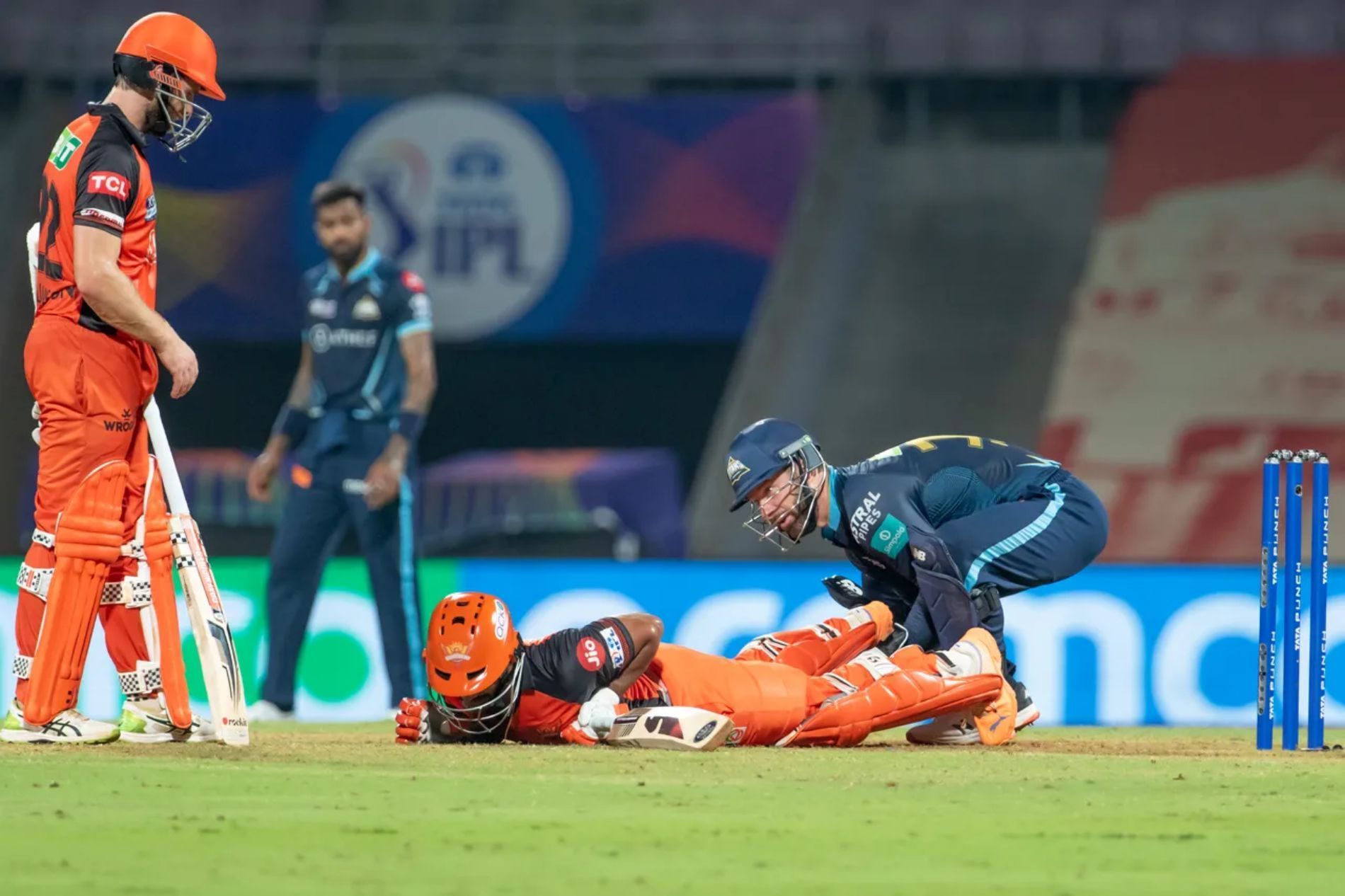 GT wicketkeeper Matthew Wade tries to help out SRH’s Rahul Tripathi after the latter picked up an injury while batting in Match 21.