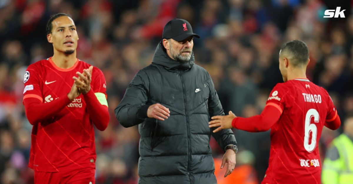 Liverpool players and Jurgen Klopp (center) react after their win against Villarreal 