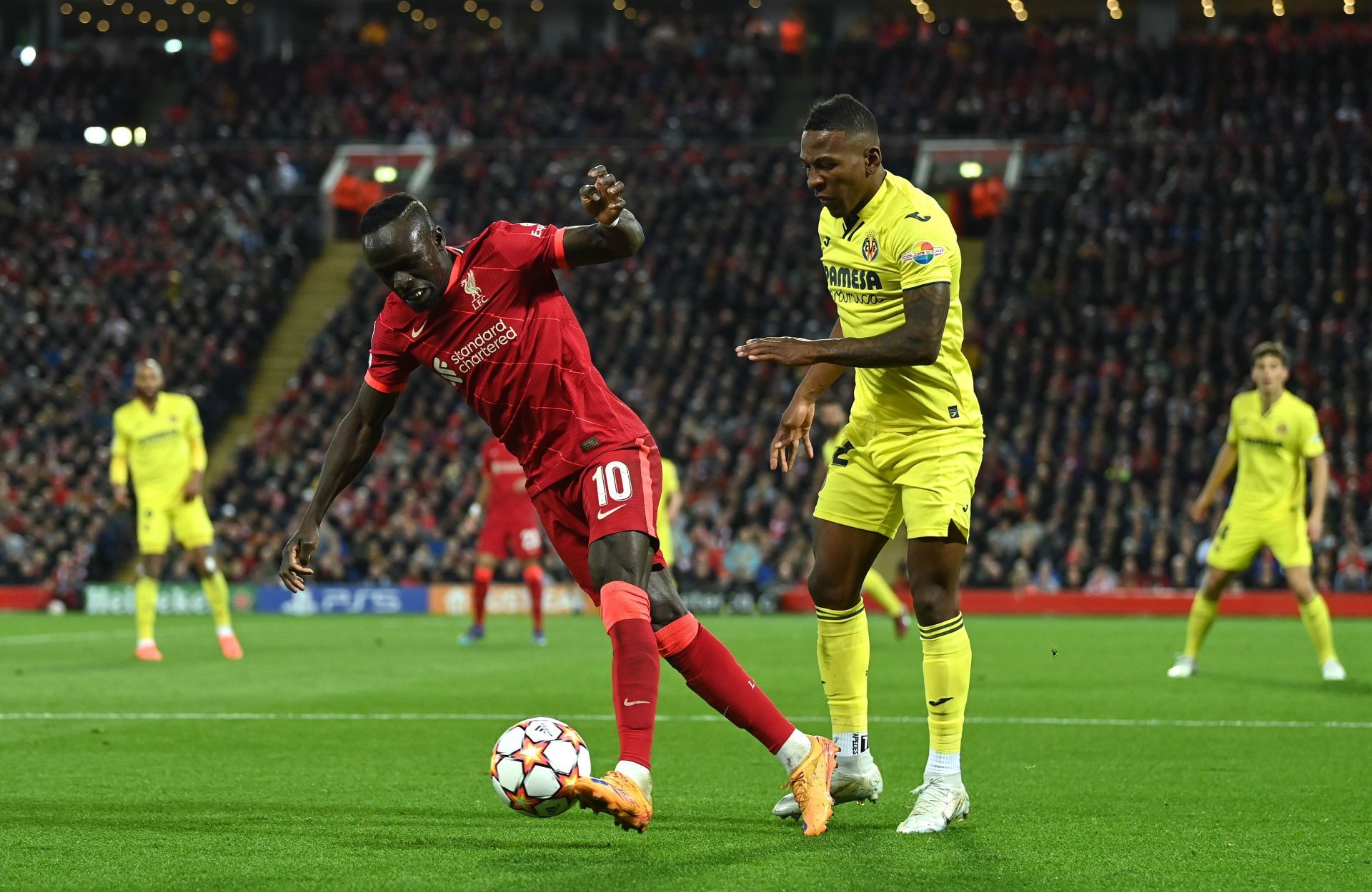 Samuel Chukwueze and Sadio Mane tussle it out.