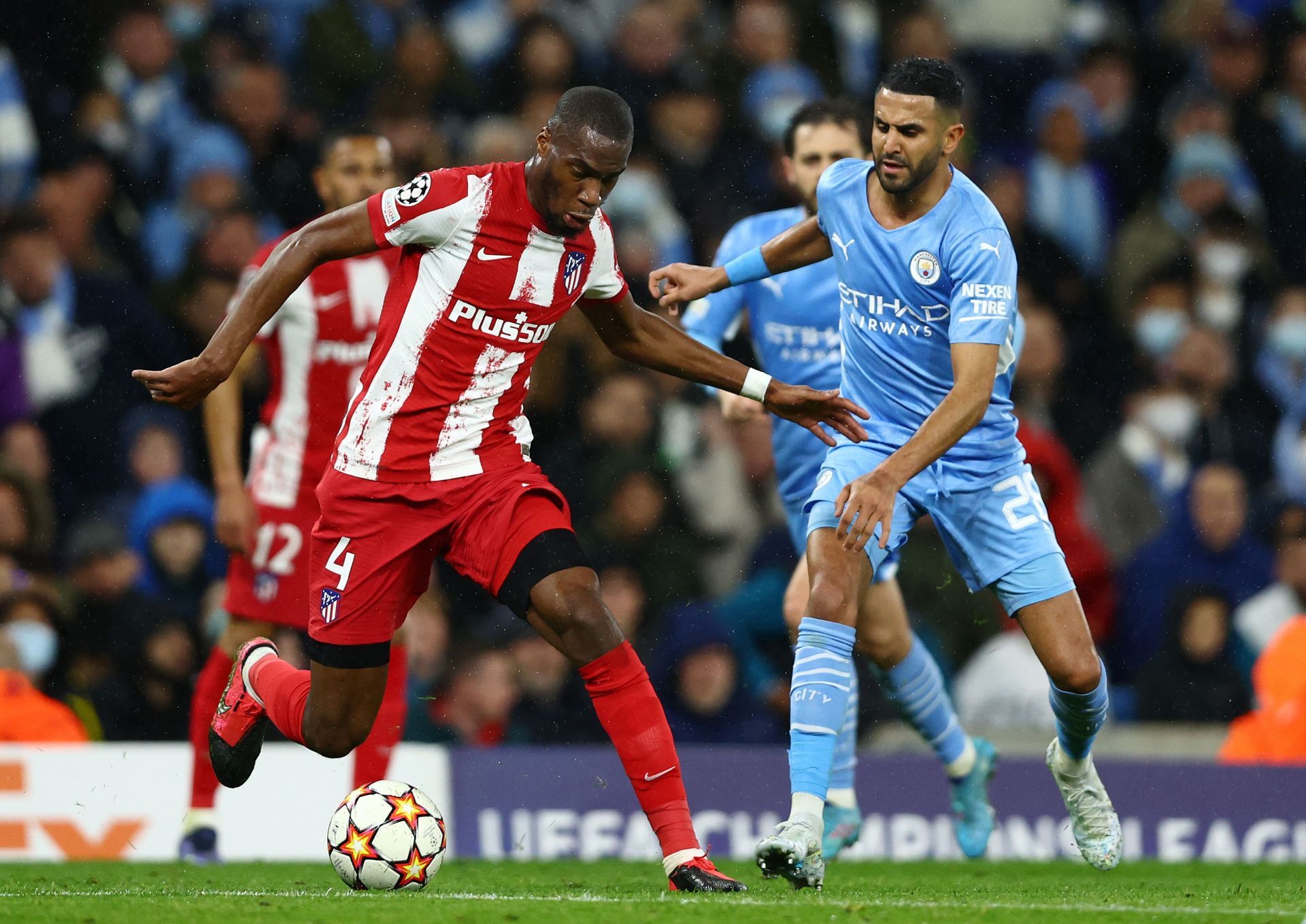 Riyad Mahrez challenges for the ball.