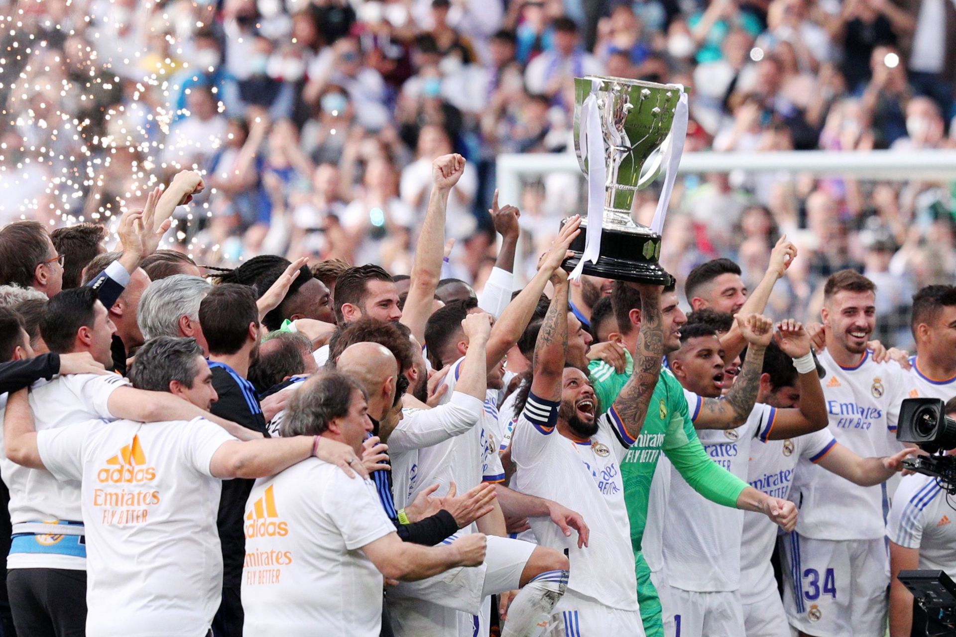 Real Madrid CF players lift the La Liga trophy.