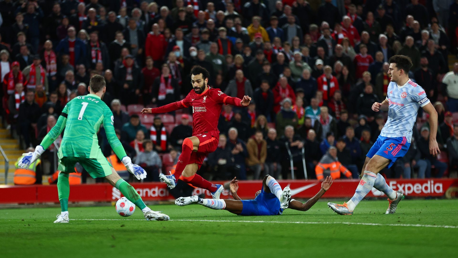 Harry Maguire struggles to keep up with Mohamed Salah.