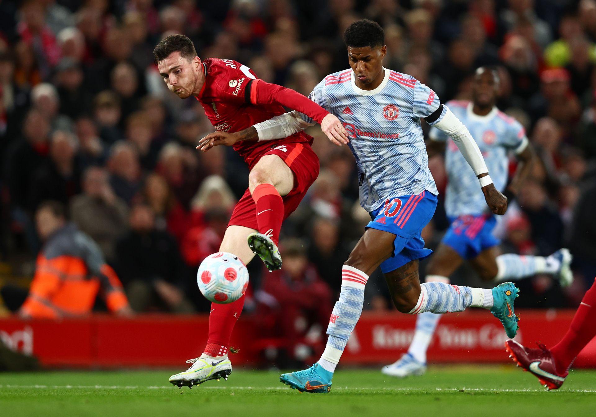 Marcus Rashford in action against Andrew Robertson