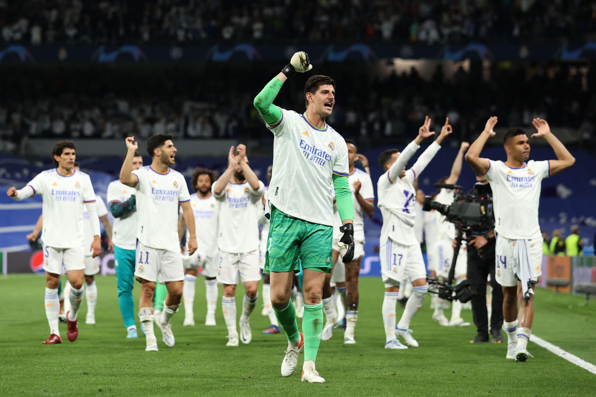 Real Madrid players celebrate after beating Manchester City