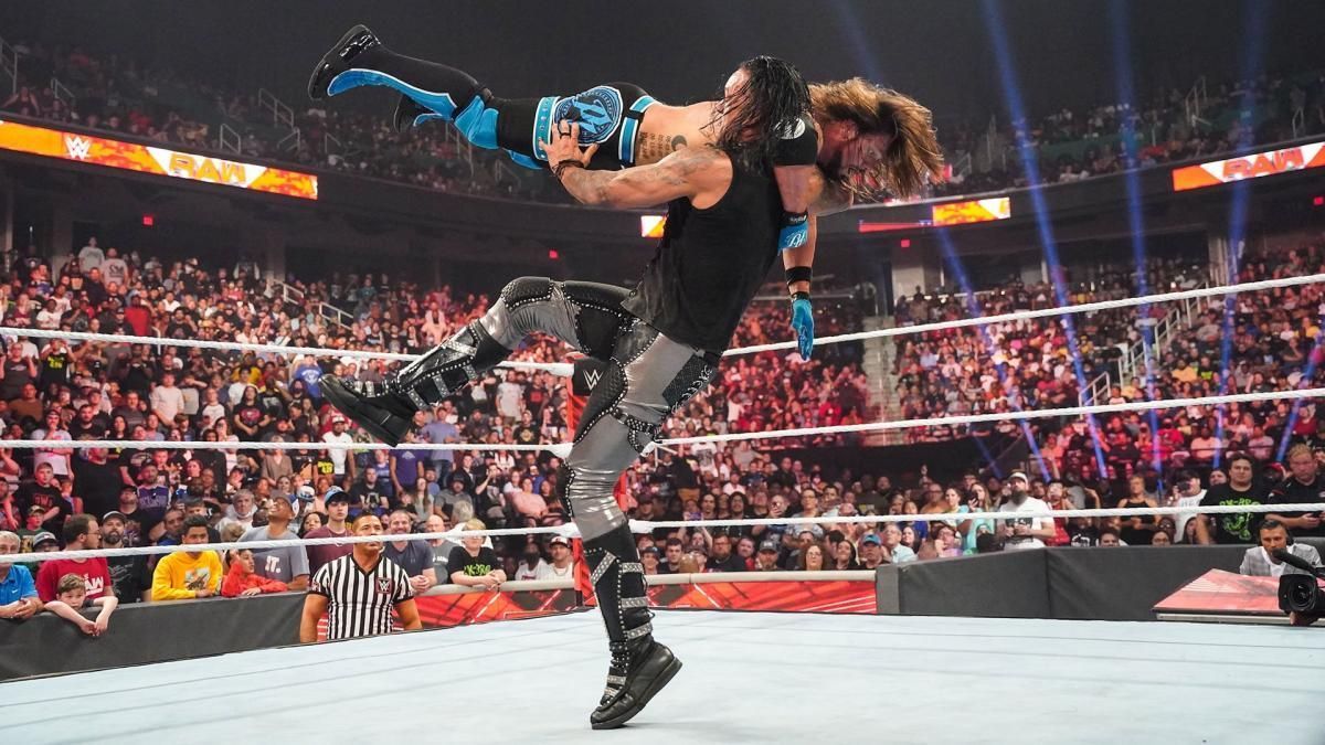 Damian Priest attacking AJ Styles following his loss on WWE RAW