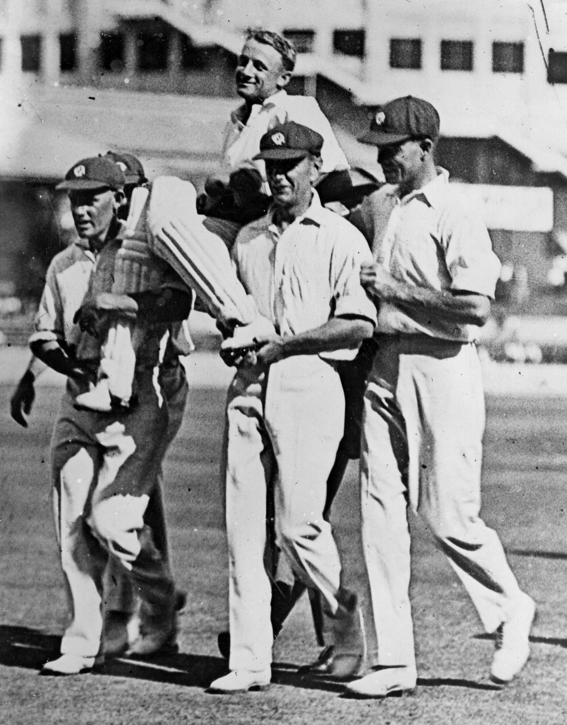 Record high! Bradman carried by jubilant New South Wales teammates at the Sydney Cricket Ground on January 6, 1930, after he scored his record-shattering unbeaten 452 against Queensland, surpassing Victorian Bill Ponsford’s 437