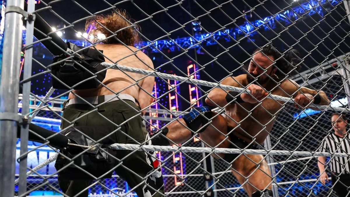 Sami Zayn and Drew McIntyre in a steel cage match