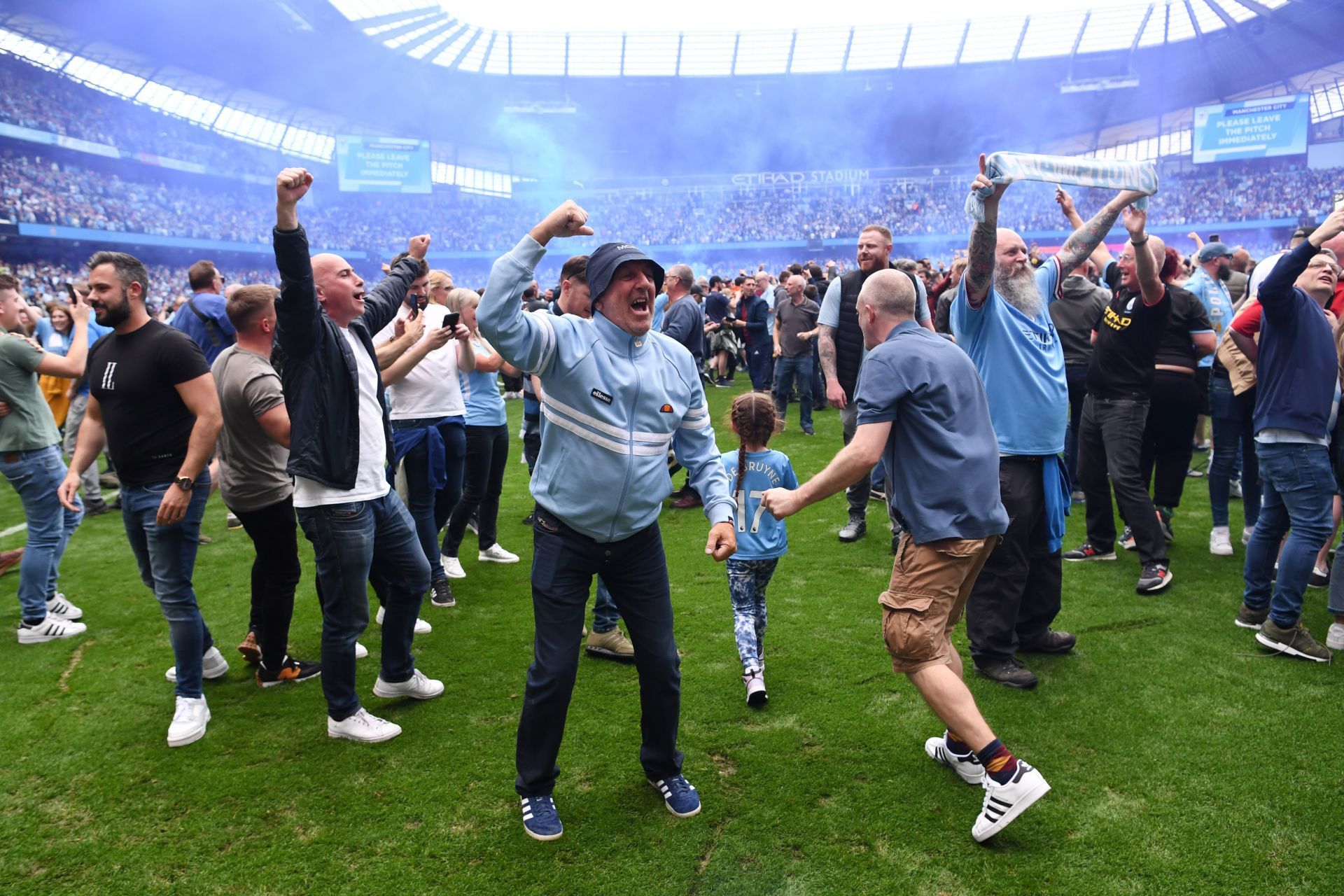 Manchester City fans celebrating after their team's win