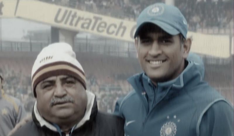 Pradeep Kumar with MS Dhoni.