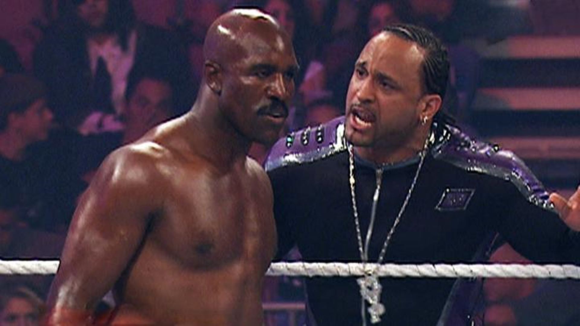 Evander Holyfield alongside WWE's MVP