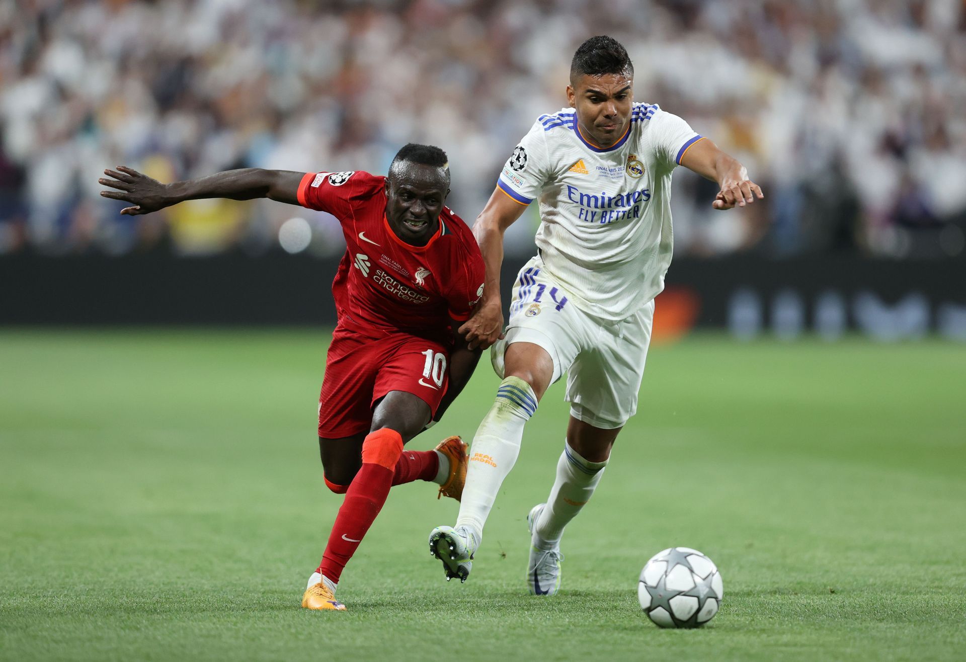 Liverpool's Sadio Mane (L) grapples with Casemiro of Real Madrid