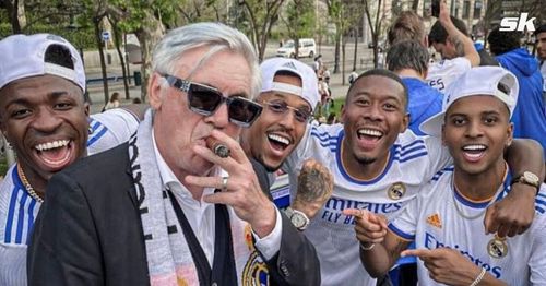 Carlo Ancelotti celebrates winning the 2021-22 La Liga title with the Real Madrid players