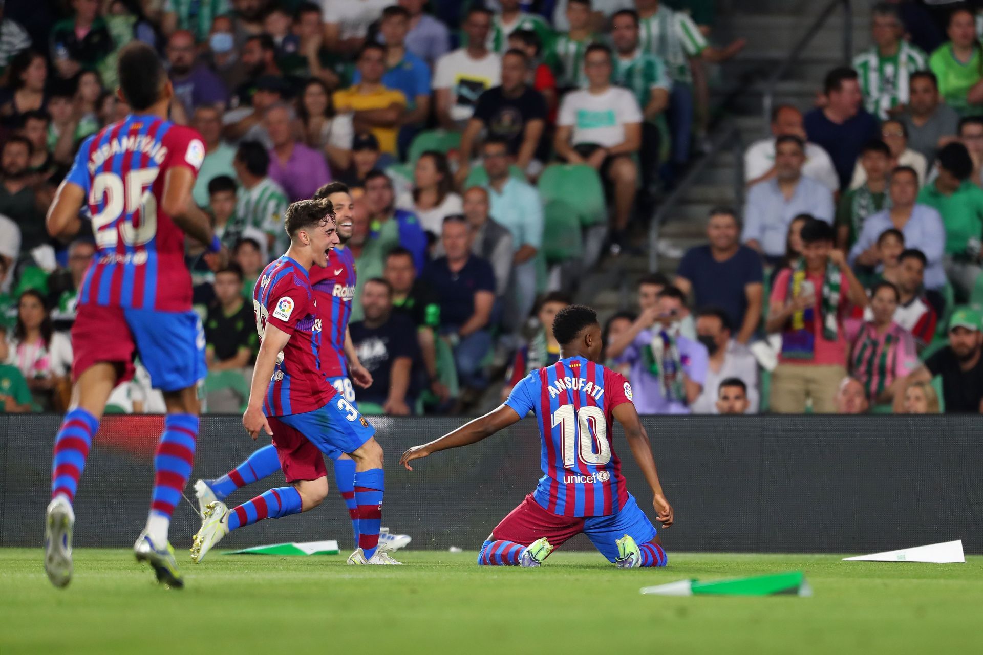 FC Barcelona players celebrate after scoring a goal.