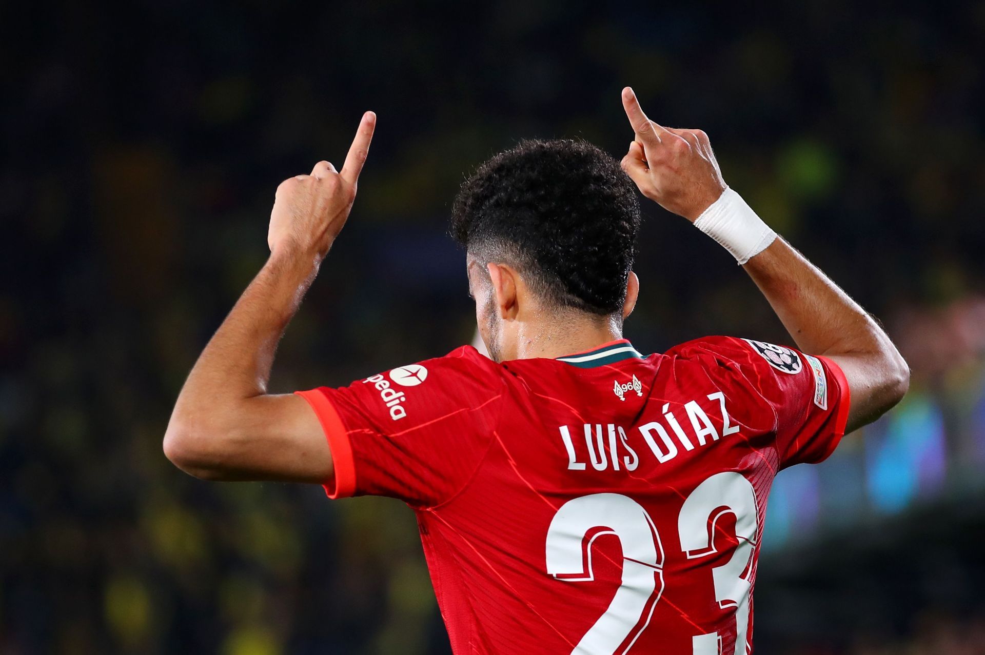 Luis Diaz celebrates after scoring a goal.