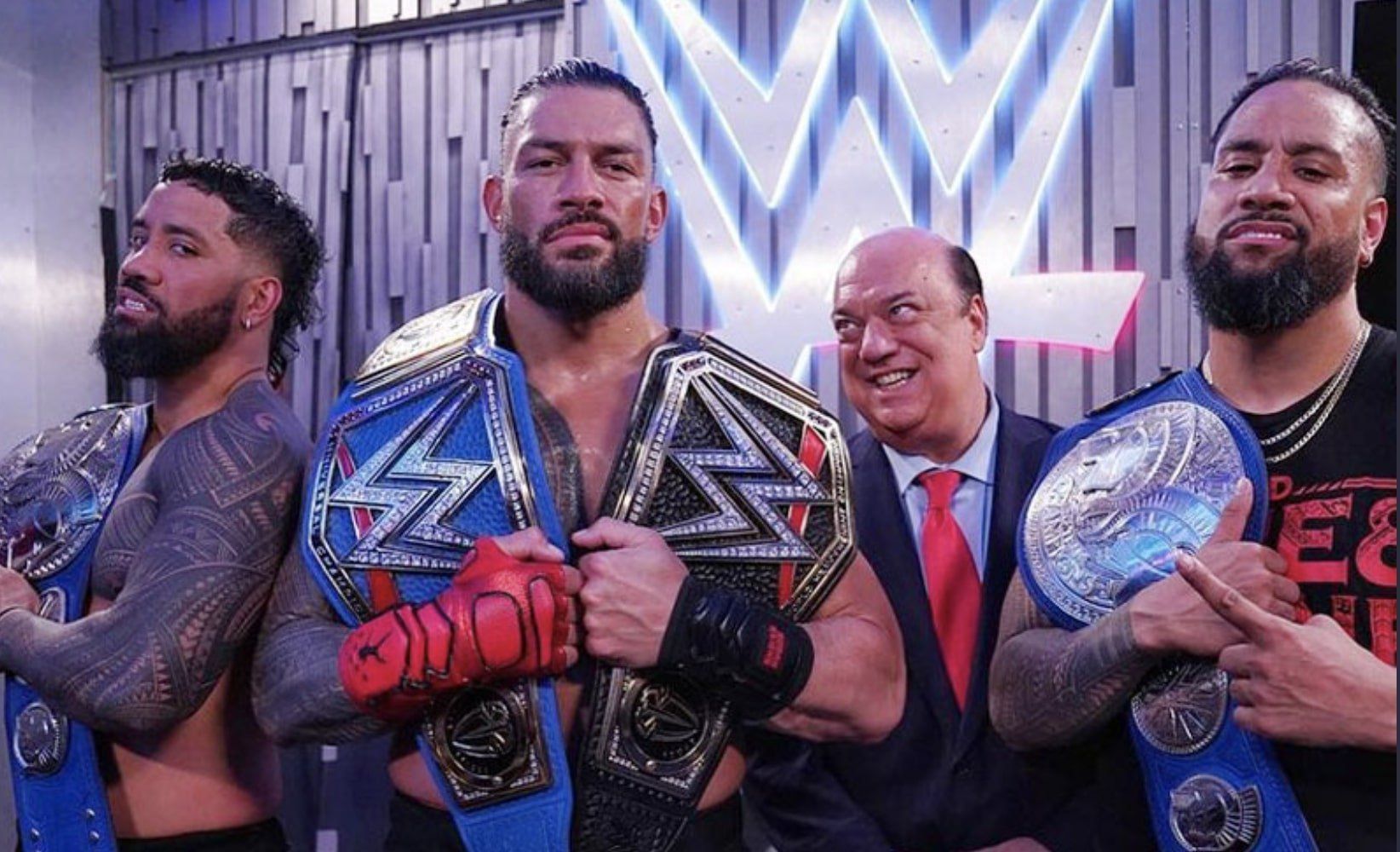 Roman Reigns, The Usos, and Paul Heyman.