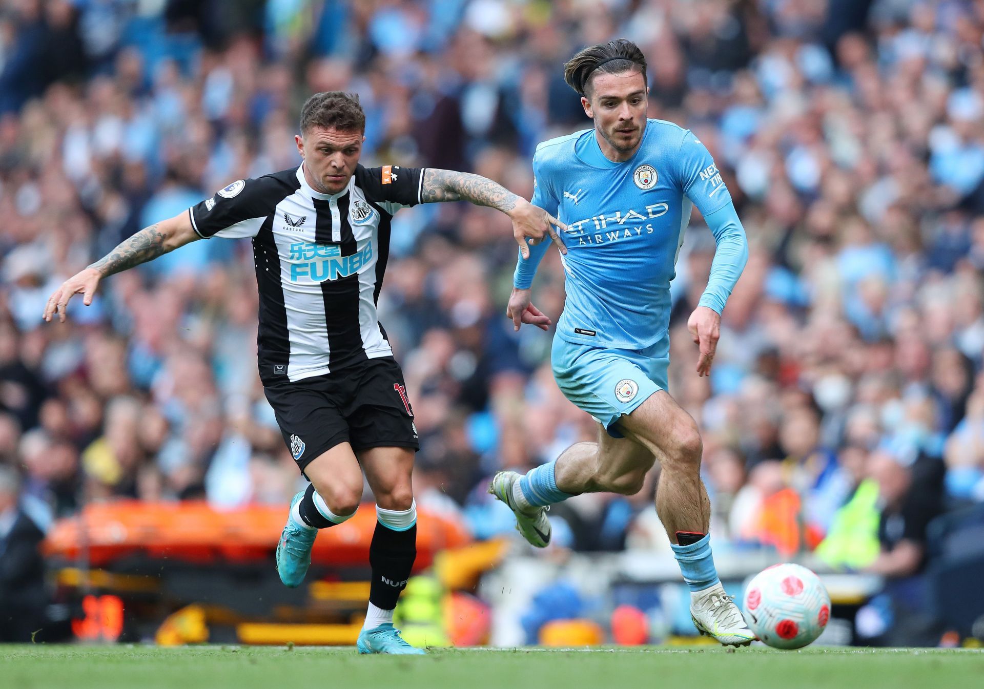 Jack Grealish (R) breezes past Newcastle United's Kieran Trippier (L)