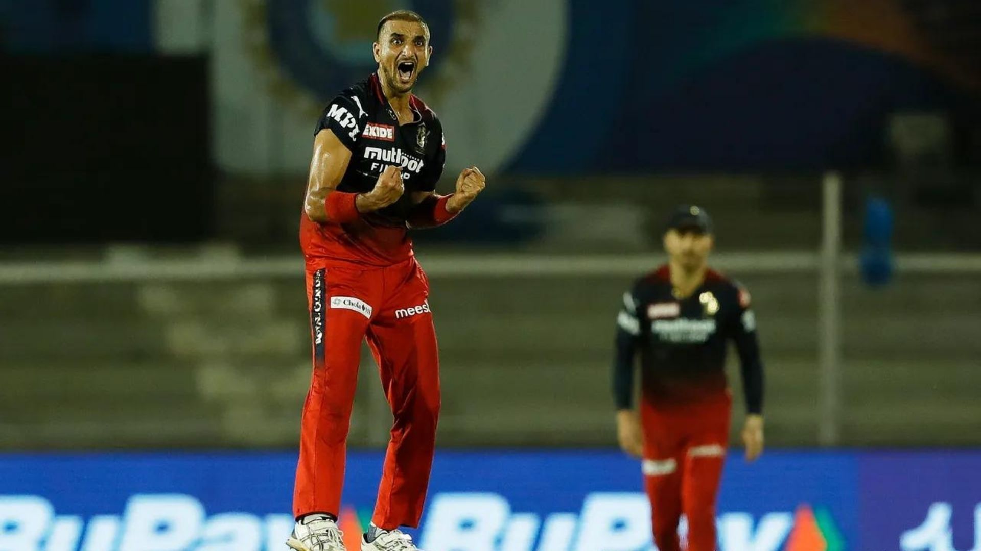 Harshal Patel (L) celebrating a wicket against PBKS. (P.C.:iplt20.com)