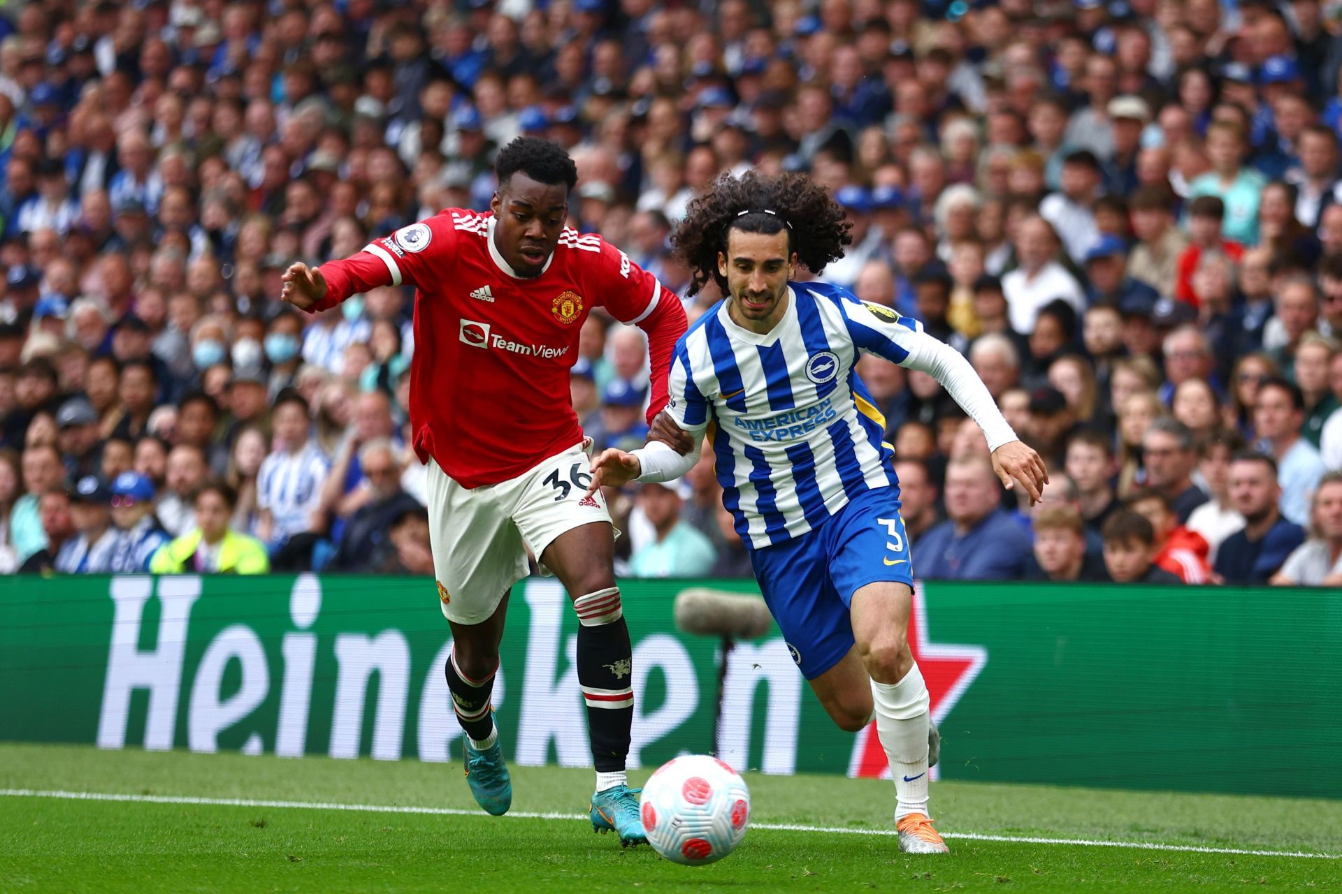 Marc Cucurella (R) gets past Anthony Elanga (L, #36)