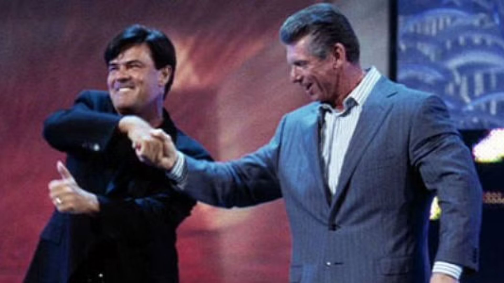 Eric Bischoff shaking Vince McMahon's hand to be General Manager of RAW