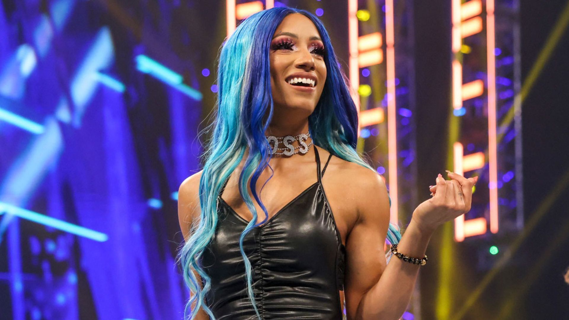 WWE Superstar Sasha Banks poses for the crowd