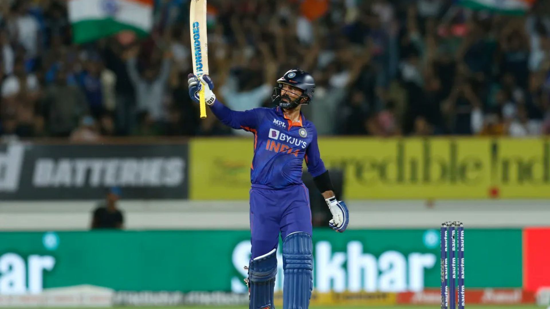 Dinesh Karthik soaks in the applause after scoring his maiden T20I fifty. (P.C.:BCCI)