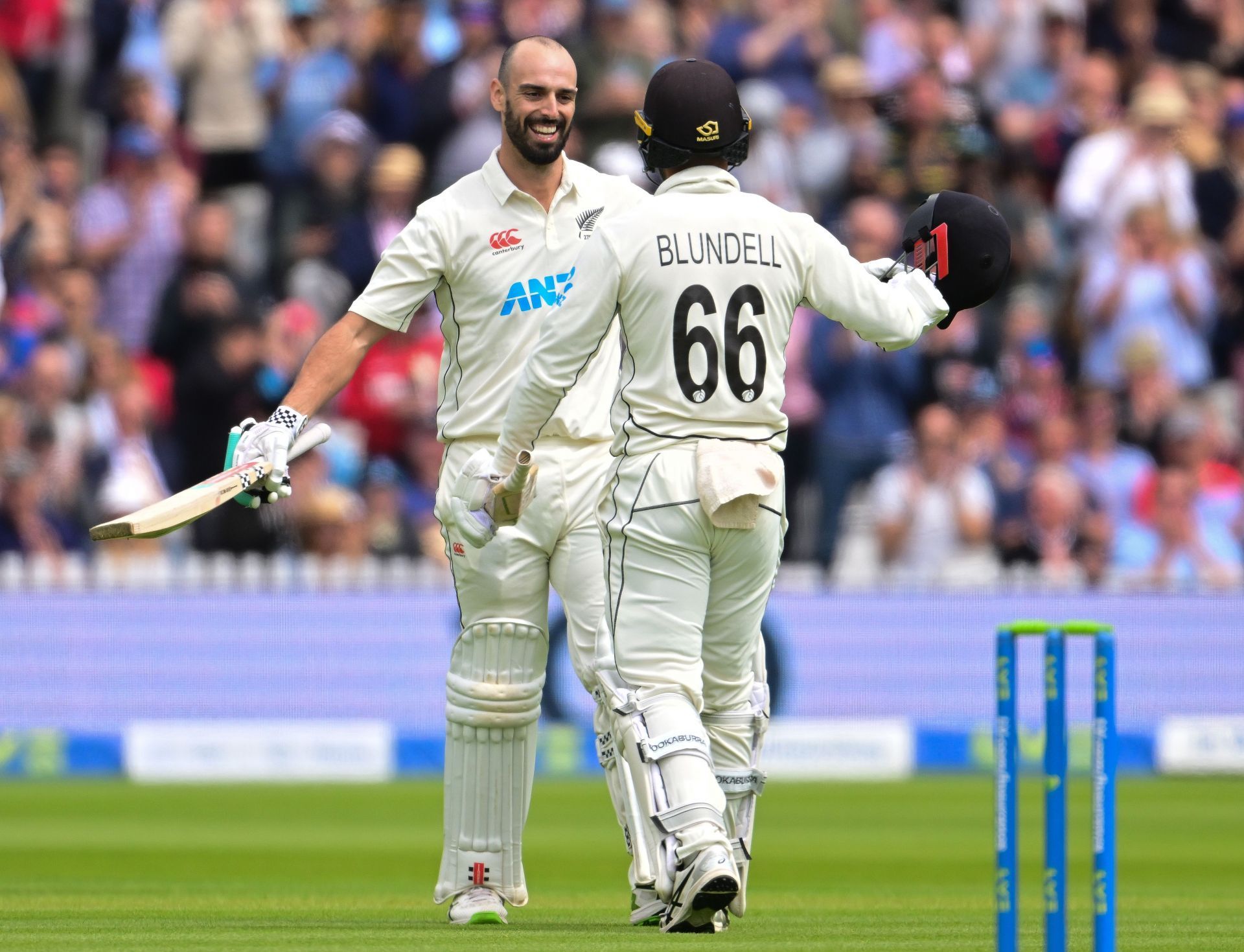 Daryl Mitchell (L) celebrates after his Test hundred on a difficult Lord&#039;s pitch.