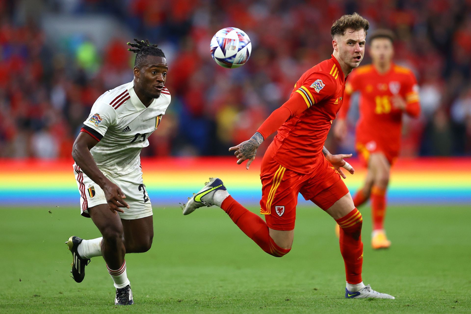 Michy Batshuayi tussles it out against Wales.