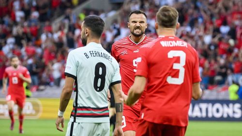 Seferovic and Widmer celebrate after they combined for Switzerland's opener in the first minute