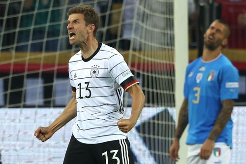 Thomas Muller celebrates scoring Germany's third goal against Italy.