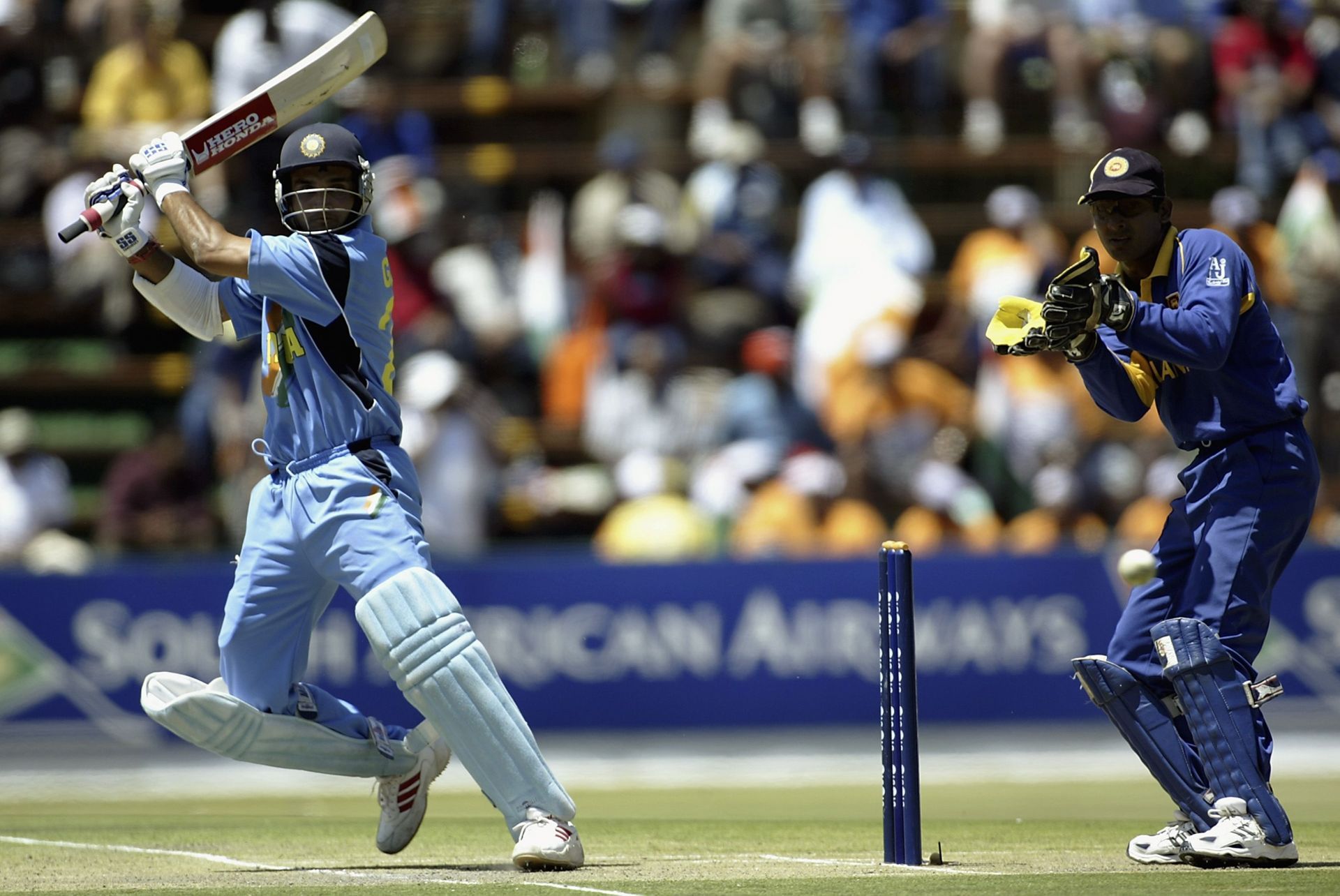 Sourav Ganguly of India hits out as Kumar Sangakkara of Sri Lanka looks on (Image courtesy: Getty Images)