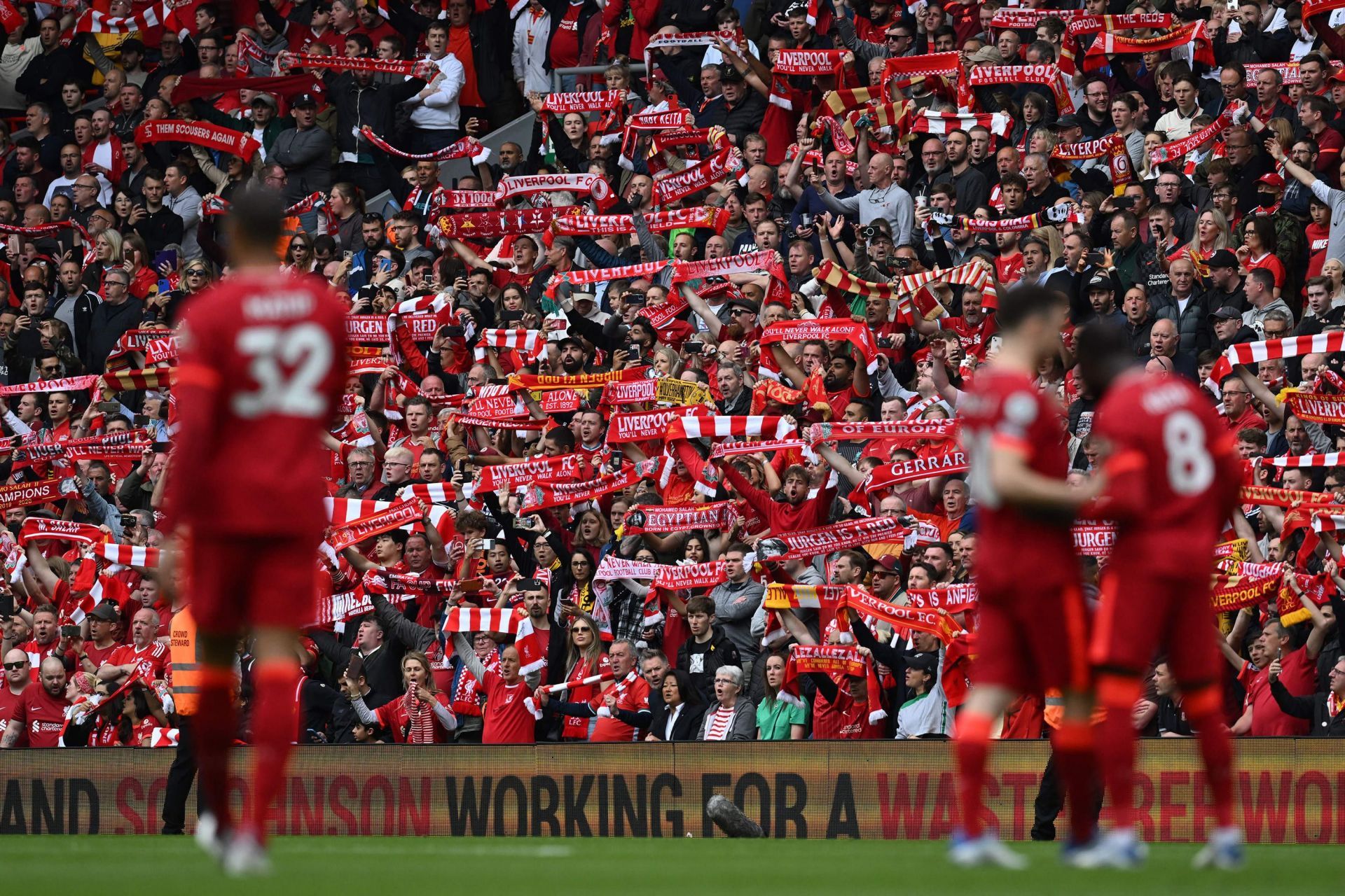 Liverpool players reconcile on the final Premier League matchday as fans watch on
