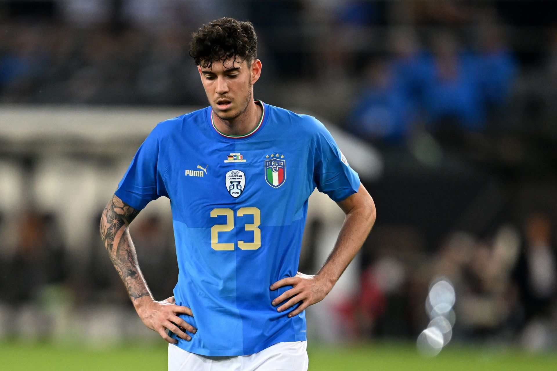 Alessandro Bastoni cuts a frustrated figure after conceding a penalty against Germany