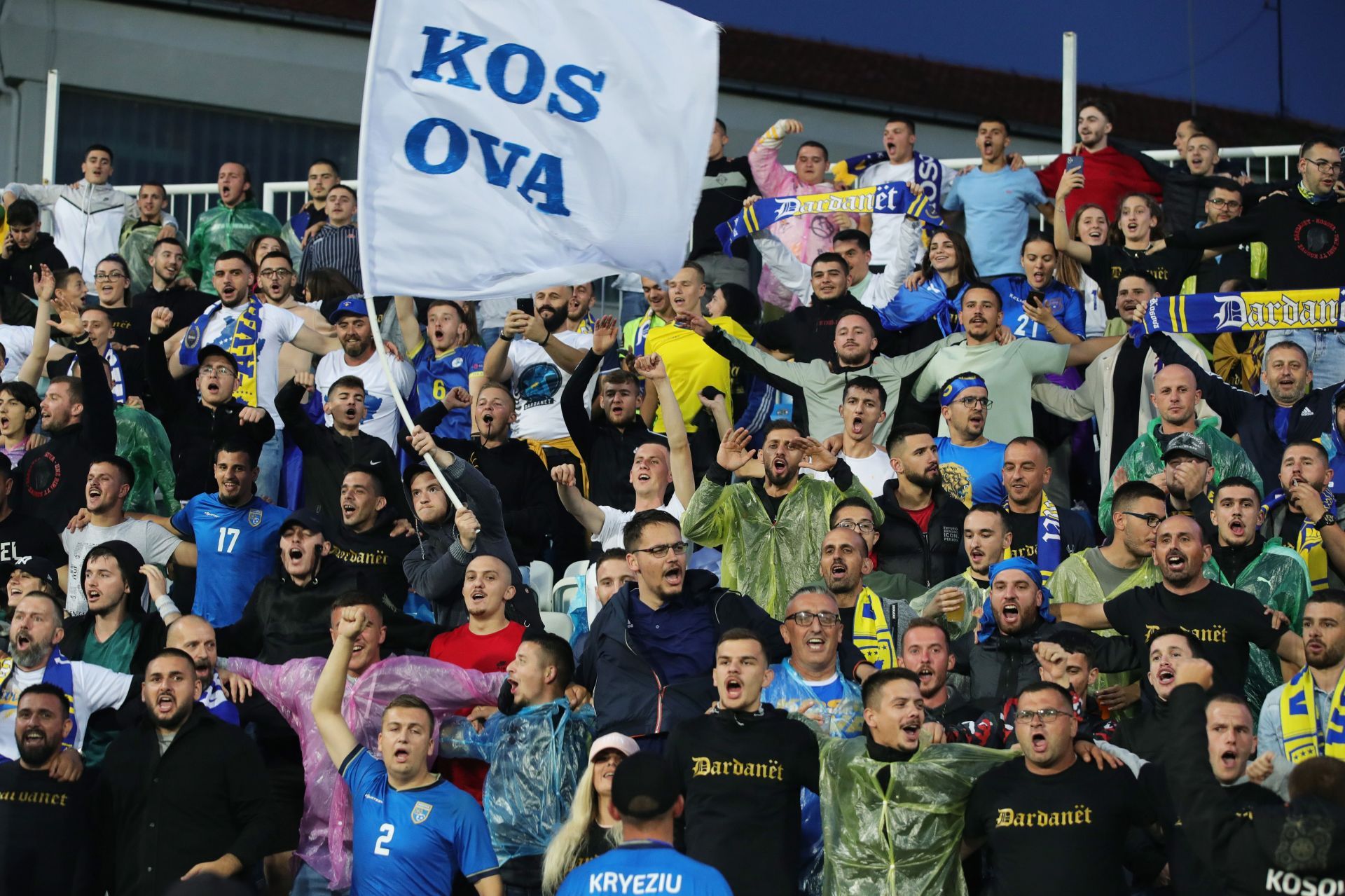 Kosovo football fans supporting their team