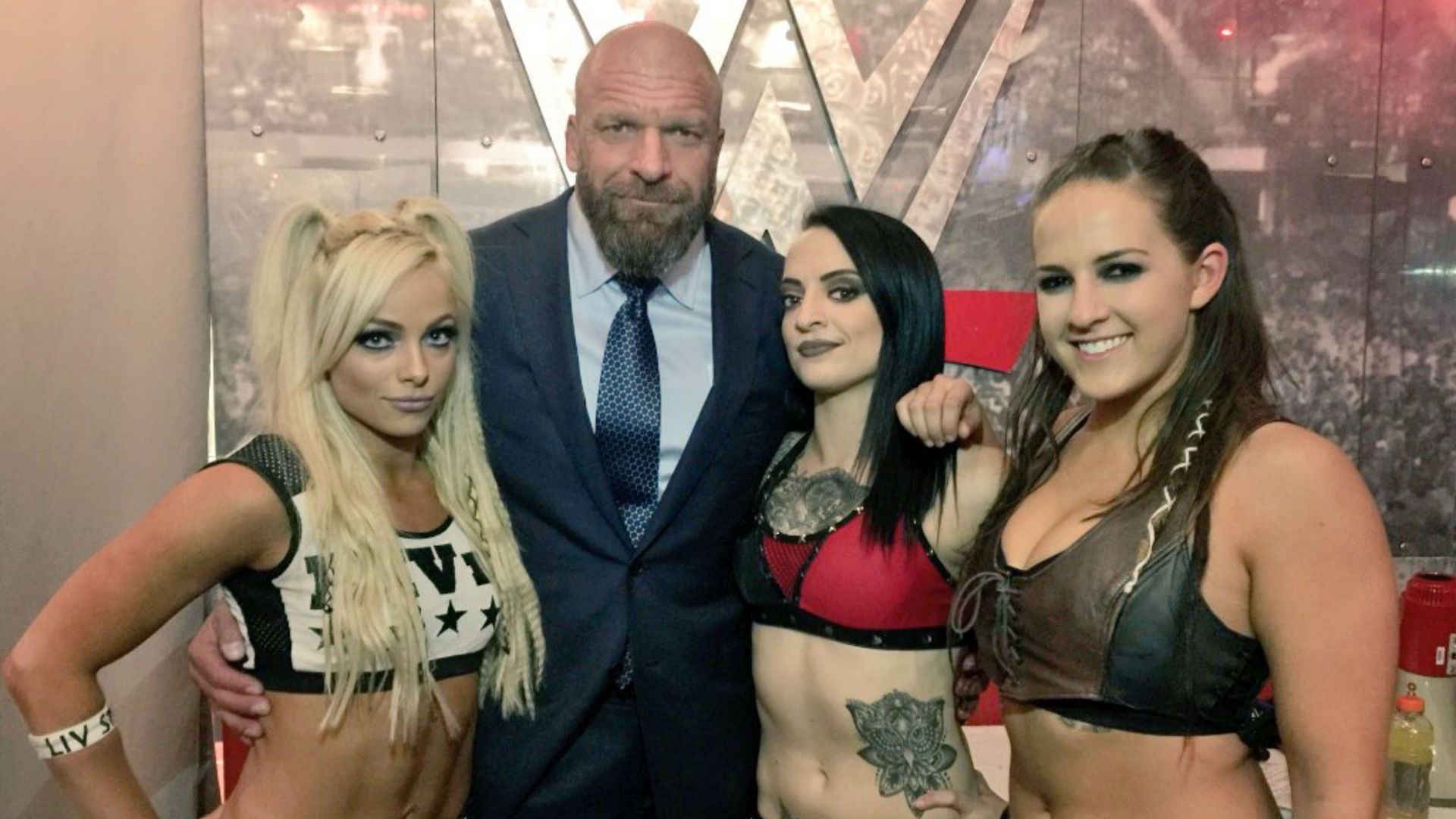 Triple H with Liv Morgan, Ruby Soho, and Sarah Logan