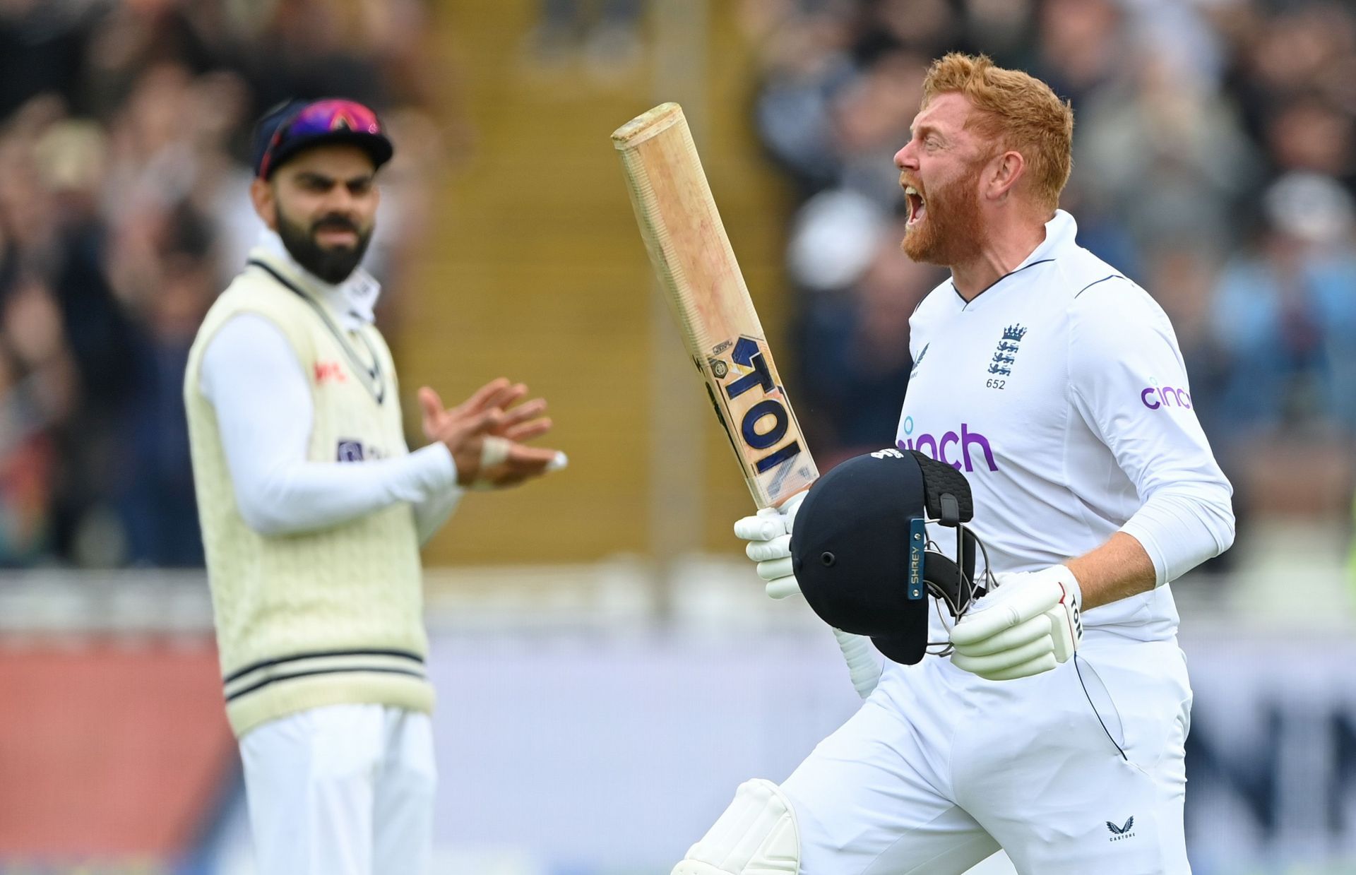 Virat Kohli (L) applauds as Jonny Bairstow roars after reaching his hundred on Day 3