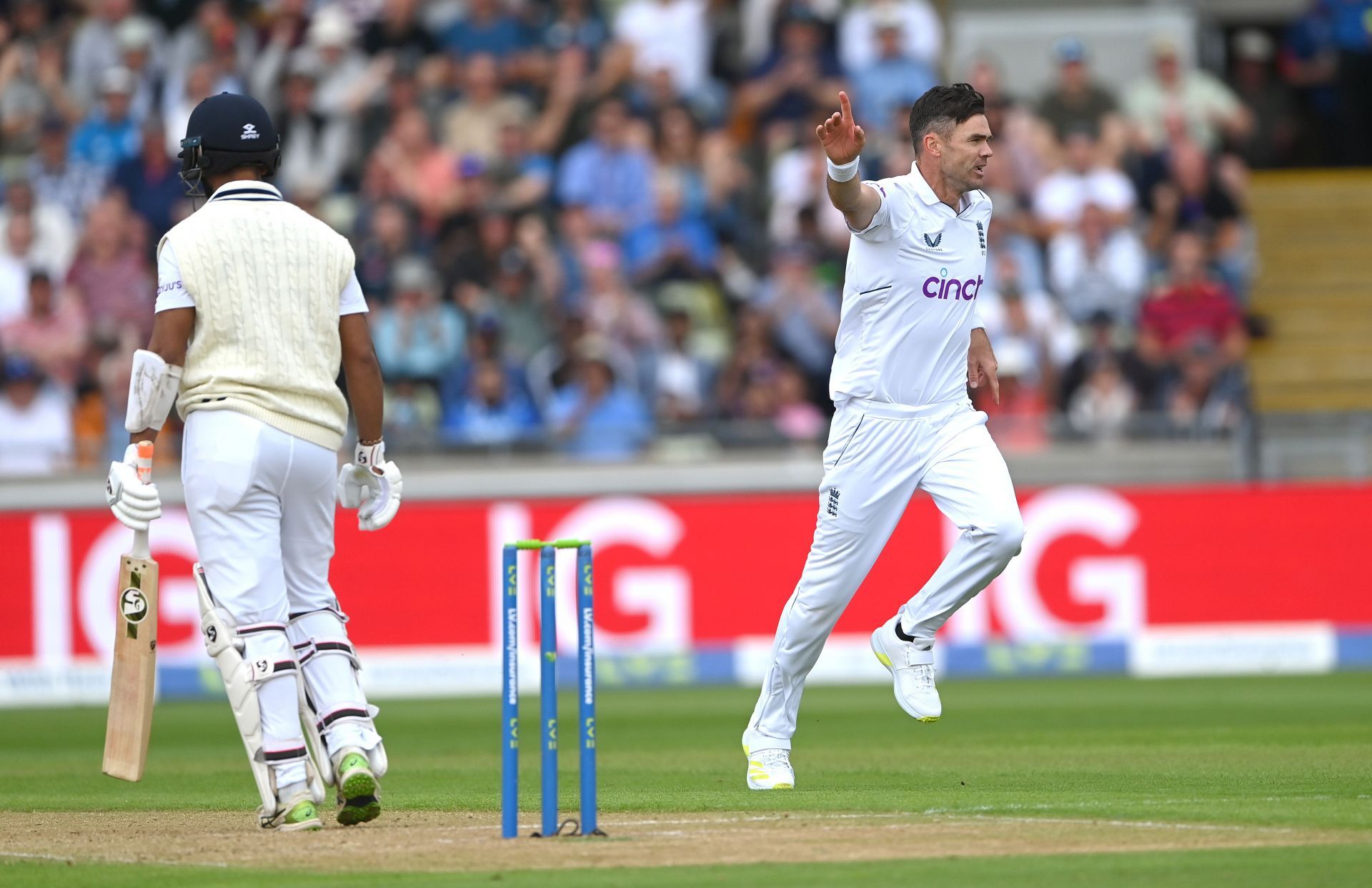James Anderson (R) celebrates after dismissing Cheteshwar Pujara during the 5th India-England Test