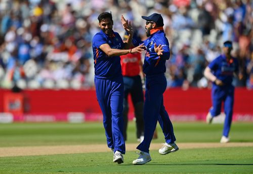 Bhuvneshwar Kumar (left) celebrates with Virat Kohli after taking the wicket of Jason Roy. Pic: Getty Images