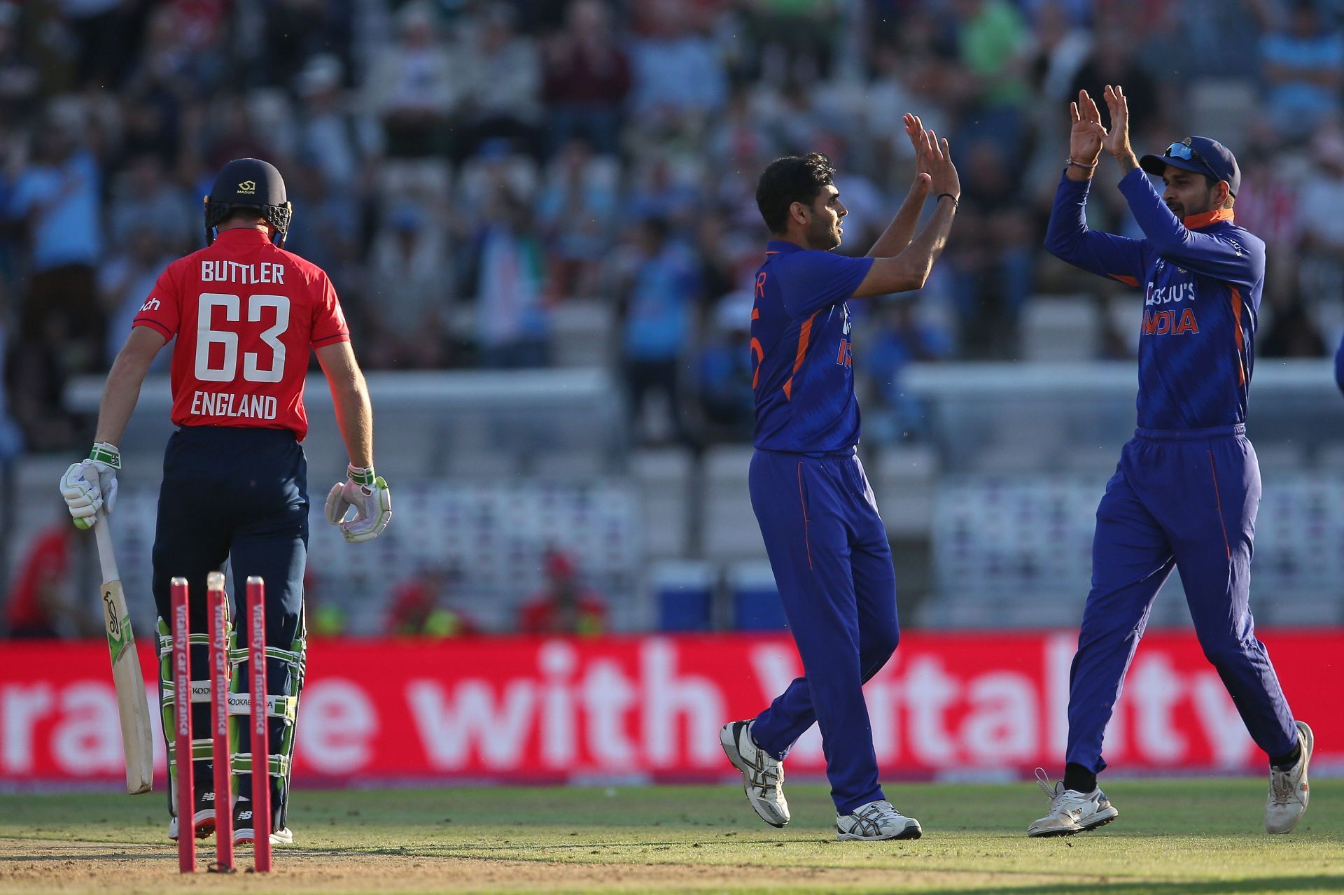 Bhuvneshwar Kumar celebrates after cleaning up Jos Buttler in the first India-England T20I.