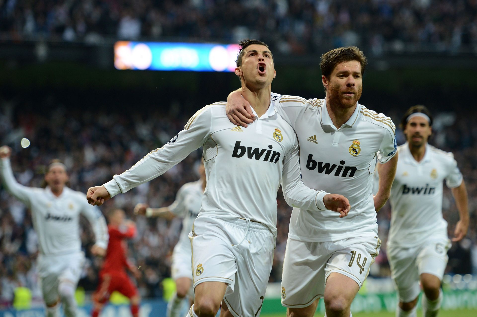 Ronadlo celebrates a goal against Bayern Munich with Xabi Alonso