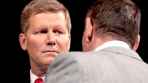 John Laurinaitis (left); Vince McMahon (right)