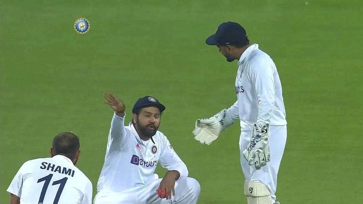 Rishabh Pant (right) encourages skipper Rohit Sharma (center) to take the review.