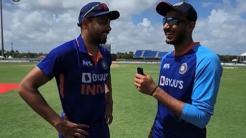 Avesh Khan (L) in conversation with Axar Patel. (P.C.:BCCI)