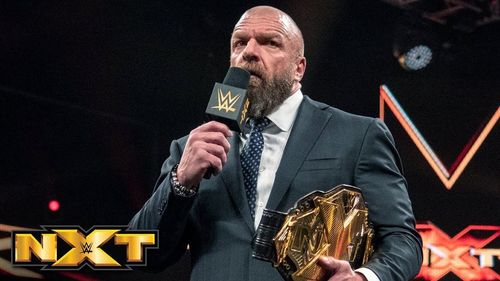 WWE Head of Creative Triple H with the NXT Championship